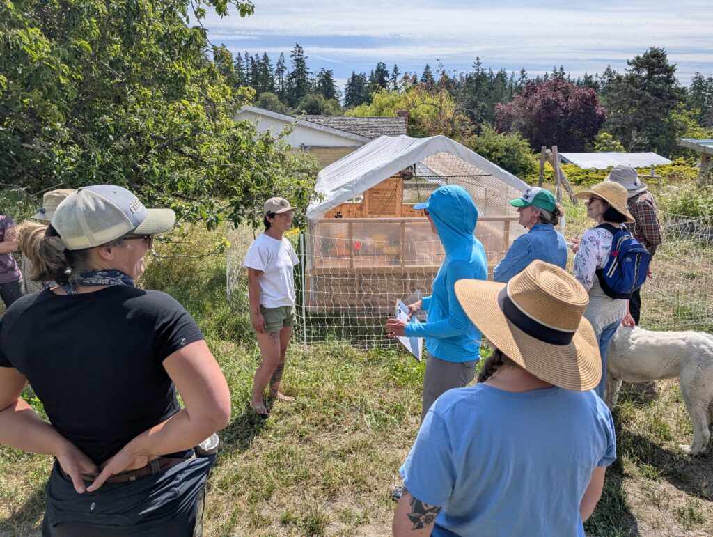 Farmer Theresa shows the class a turkey and chick brooder