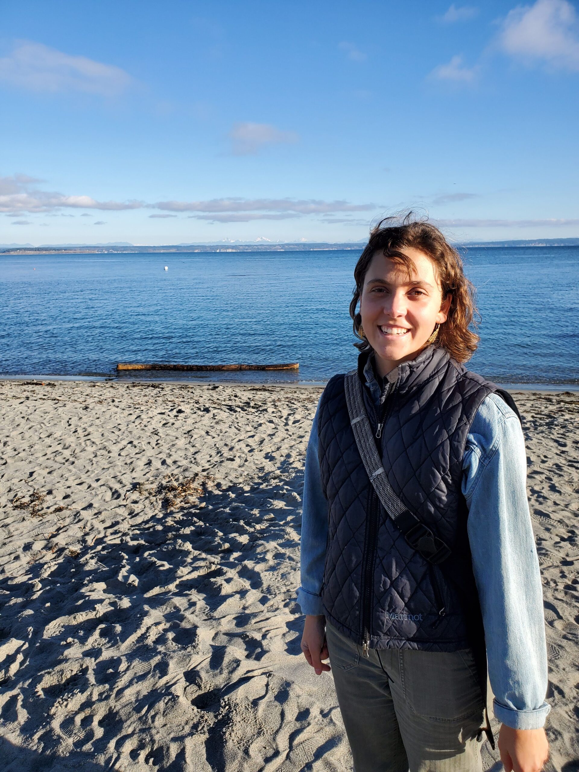 Sammi Grieger standing on a beach. 
