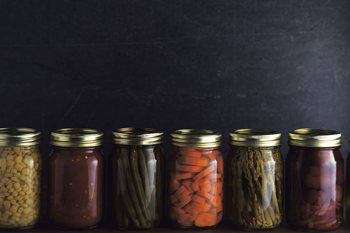 Photo of colorful canned fruits and vegetables lined up in a row