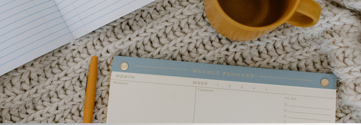 Calendar and cup of coffee