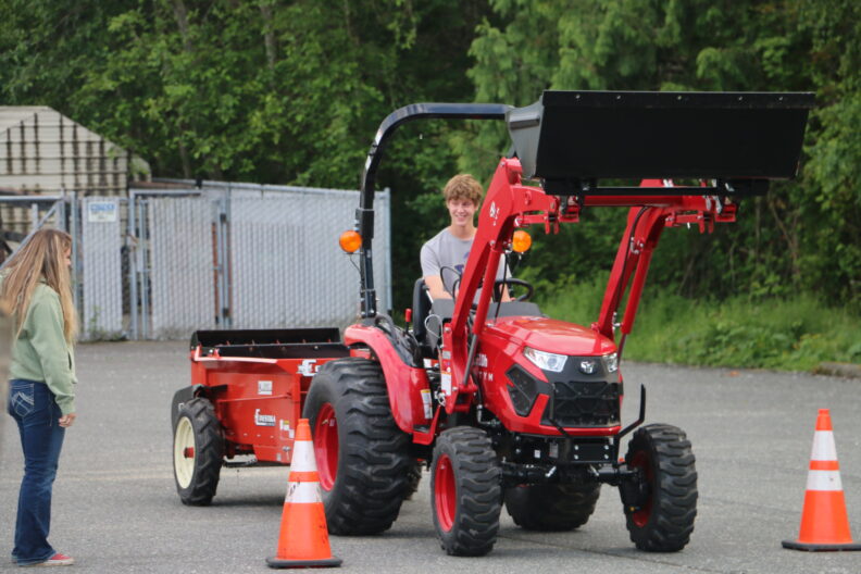 Farm Machinery Safety student navigating the driving course