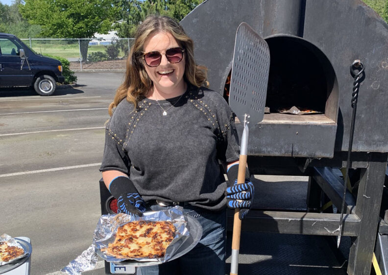 Maddy Vanderkooy displays final pizza afte