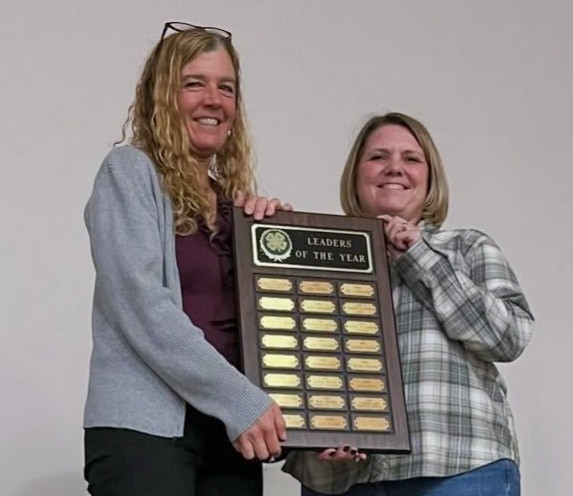 4-H club leaders being recognized for award