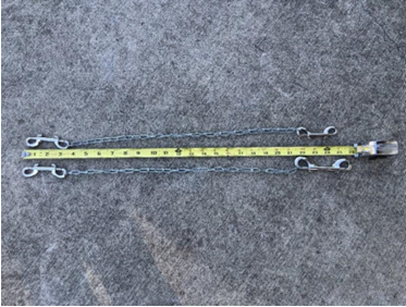Benching chains with swivel snap at each end appropriate for benching your dog at fair shown with a measuring tape to highlight the length.