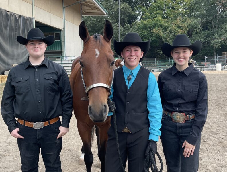 Senior Equine members posing with their horse at the State Fair.