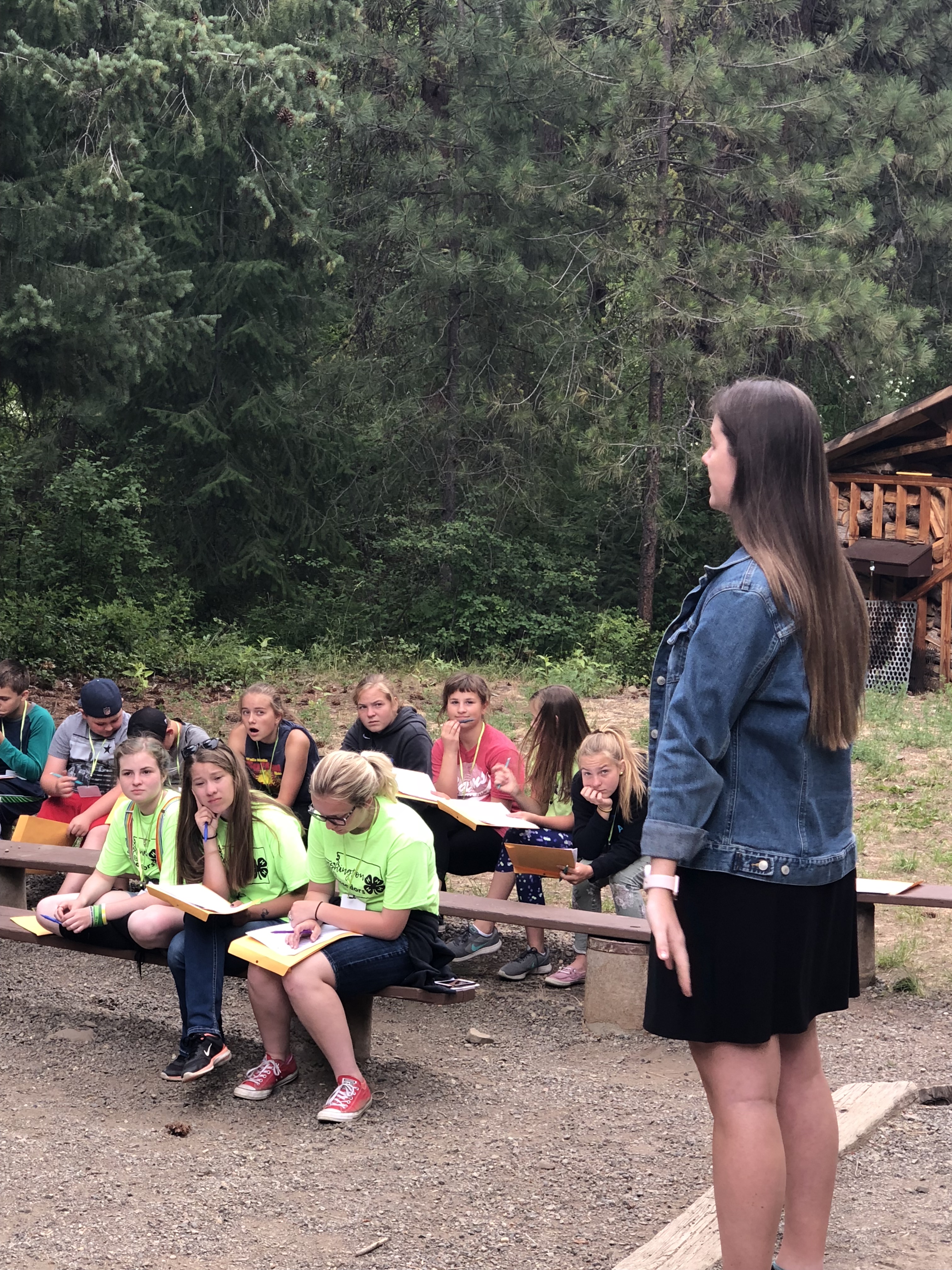 Girl giving presentation at 4-H camp