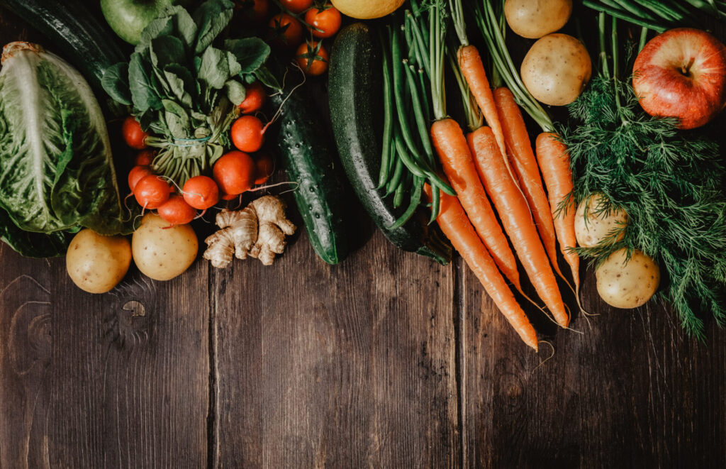 Fresh vegetables on wooden boards
