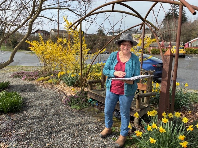 Volunteer at the Minnie Nakano Park checking on the plants
