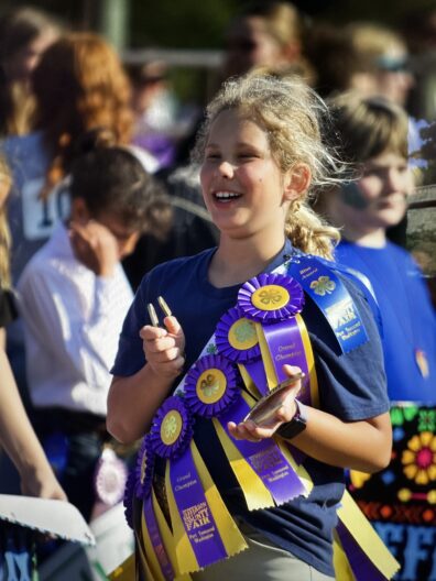 Youth with ribbons at Jefferson County Fair