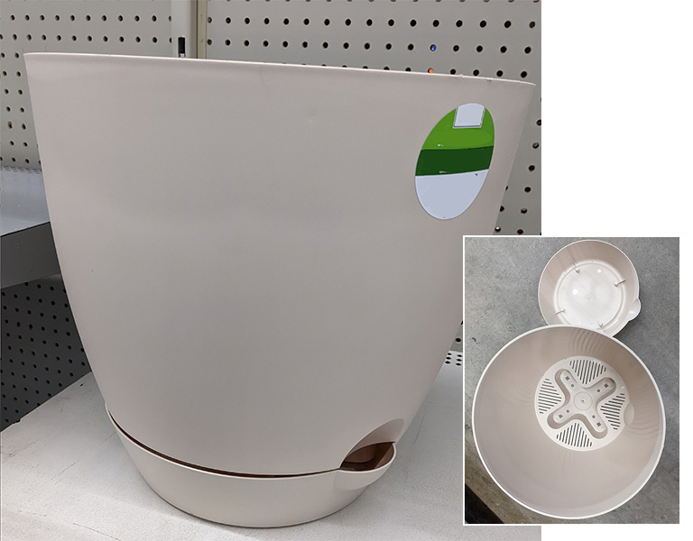 A plastic self-watering plant pot.
Reservoir of self-watering plant pot.