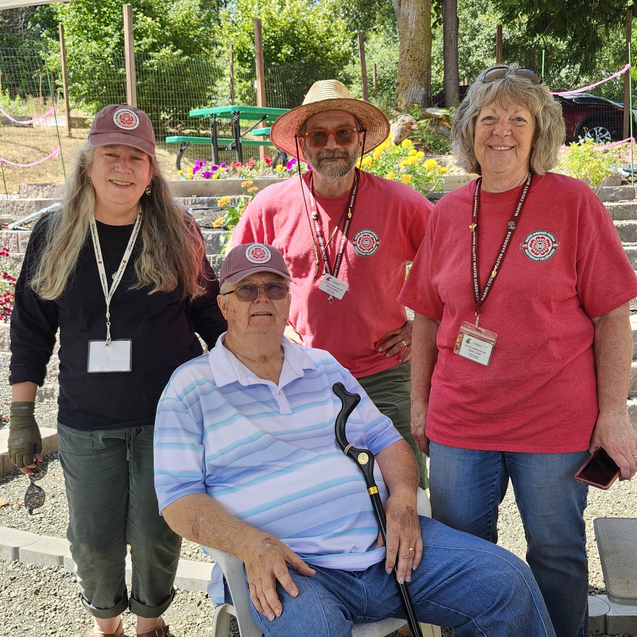 Group of Master Gardeners in front of the pollinator garden.