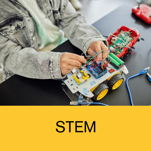 Photo of youth playing with EV3 Lego Robotics to denote STEM section of website