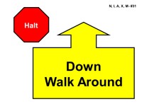 A red octagonal stop sign labeled “Halt” in white text appears in the upper left. To the right is a large yellow arrow outlined in black pointing upward, attached to a wide rectangular base. Inside the base, bold black text reads “Down Walk Around.”