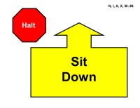 A sign on a light gray background featuring two distinct elements. In the upper left corner is a red octagon outlined in black with the word “Halt” in white text. Below and slightly to the right is a large yellow shape outlined in black, resembling a rectangular block with an upward-pointing arrow at the top. Inside the yellow shape, the words “Sit Down” are centered in bold black text.