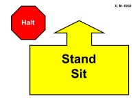 A red octagonal sign labeled “Halt” appears in the upper left. To the right is a large yellow arrow outlined in black pointing straight upward, attached to a wide rectangular base. Inside the base, bold black text reads “Stand Sit.”