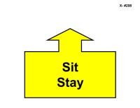 A large yellow arrow outlined in black points straight upward, attached to a wide rectangular base. Inside the base, bold black text reads “Sit Stay.”