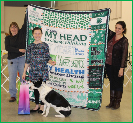 Quilt with 4-H pledge and girl at 4-H Dog show