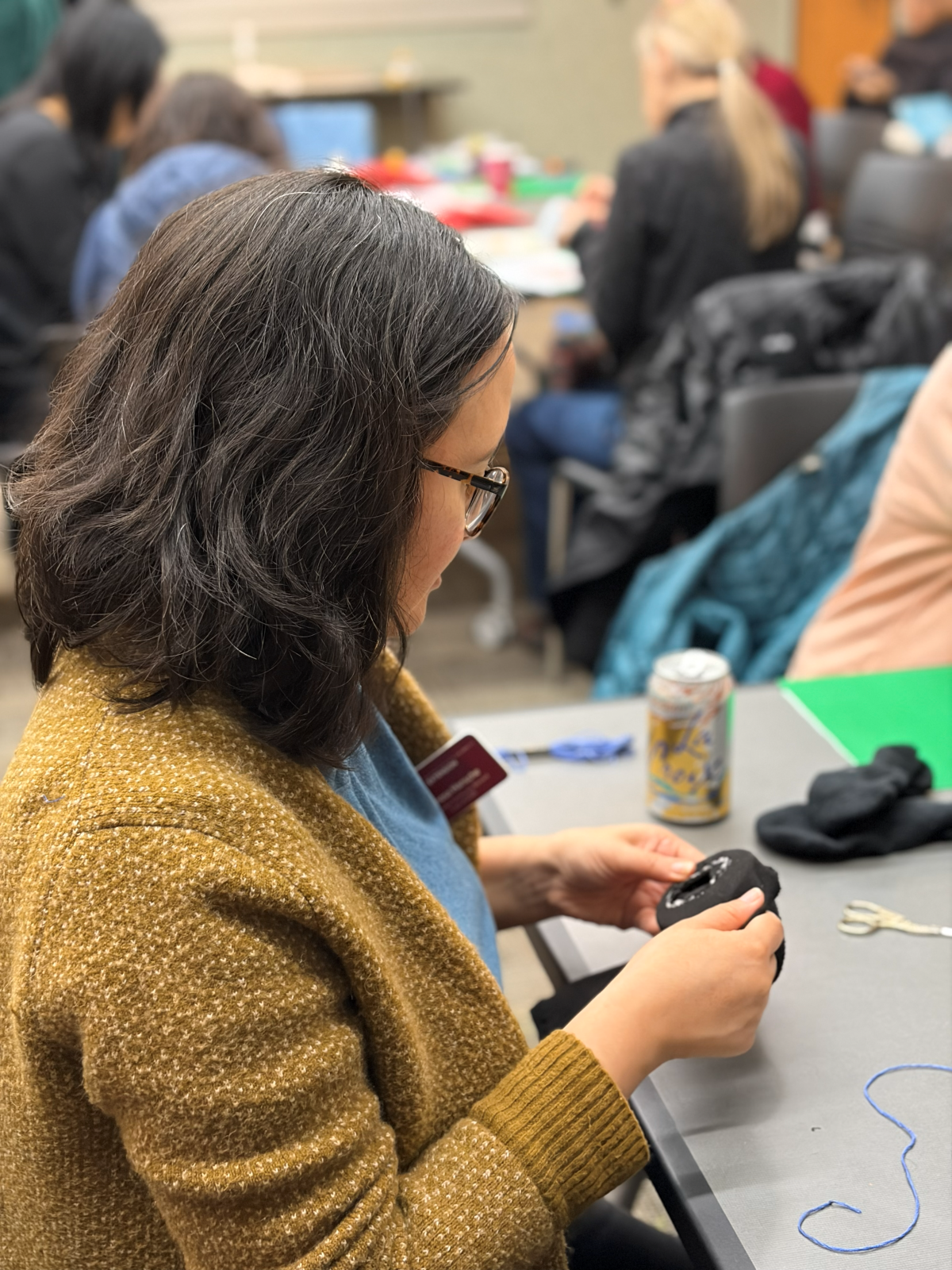 Woman darning a sock