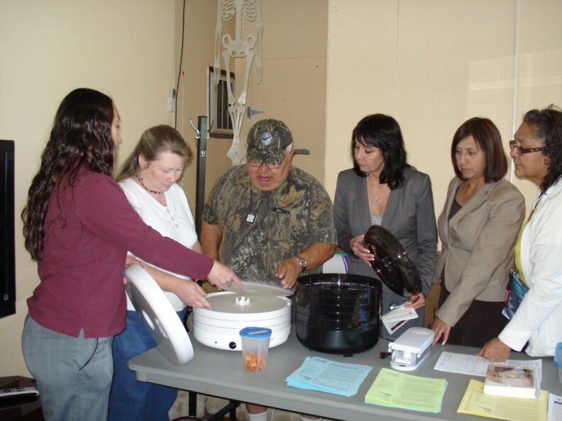 People looking at a food dehydrators.