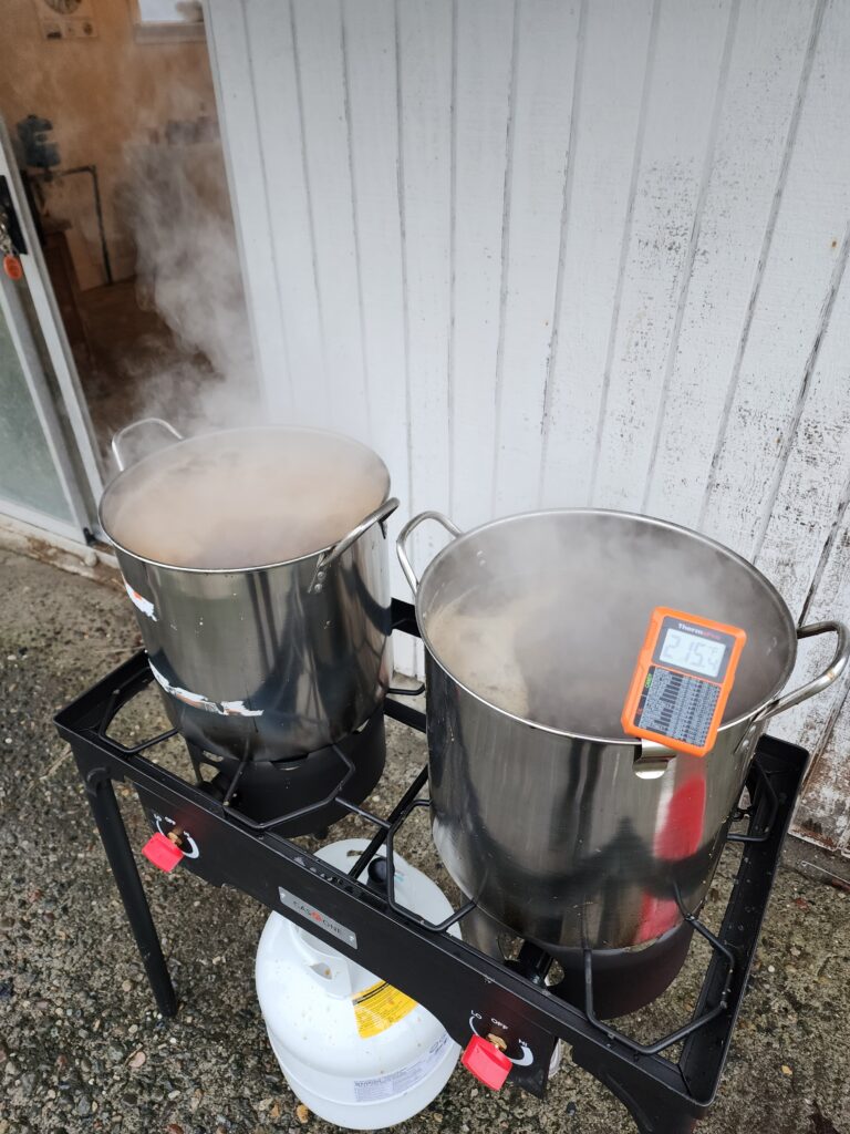 Syrup being finished on stockpots over a propane stove.