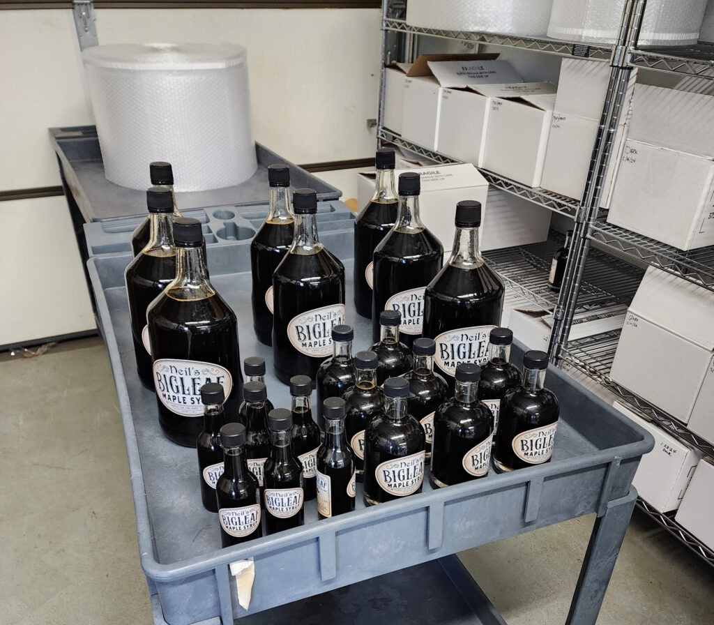 Bigleaf maple syrup on a cart.