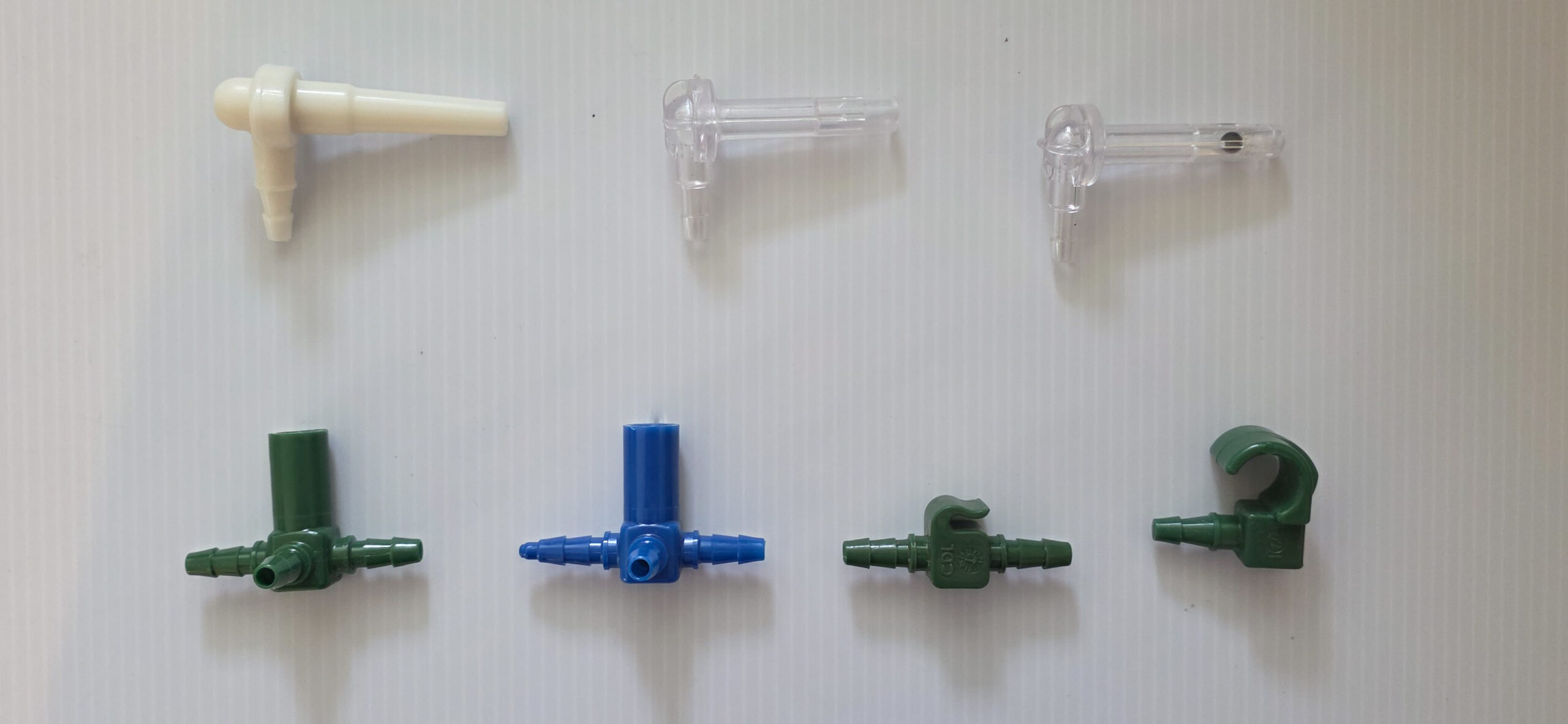 A variety of plastic taps and fittings for tubing systems.