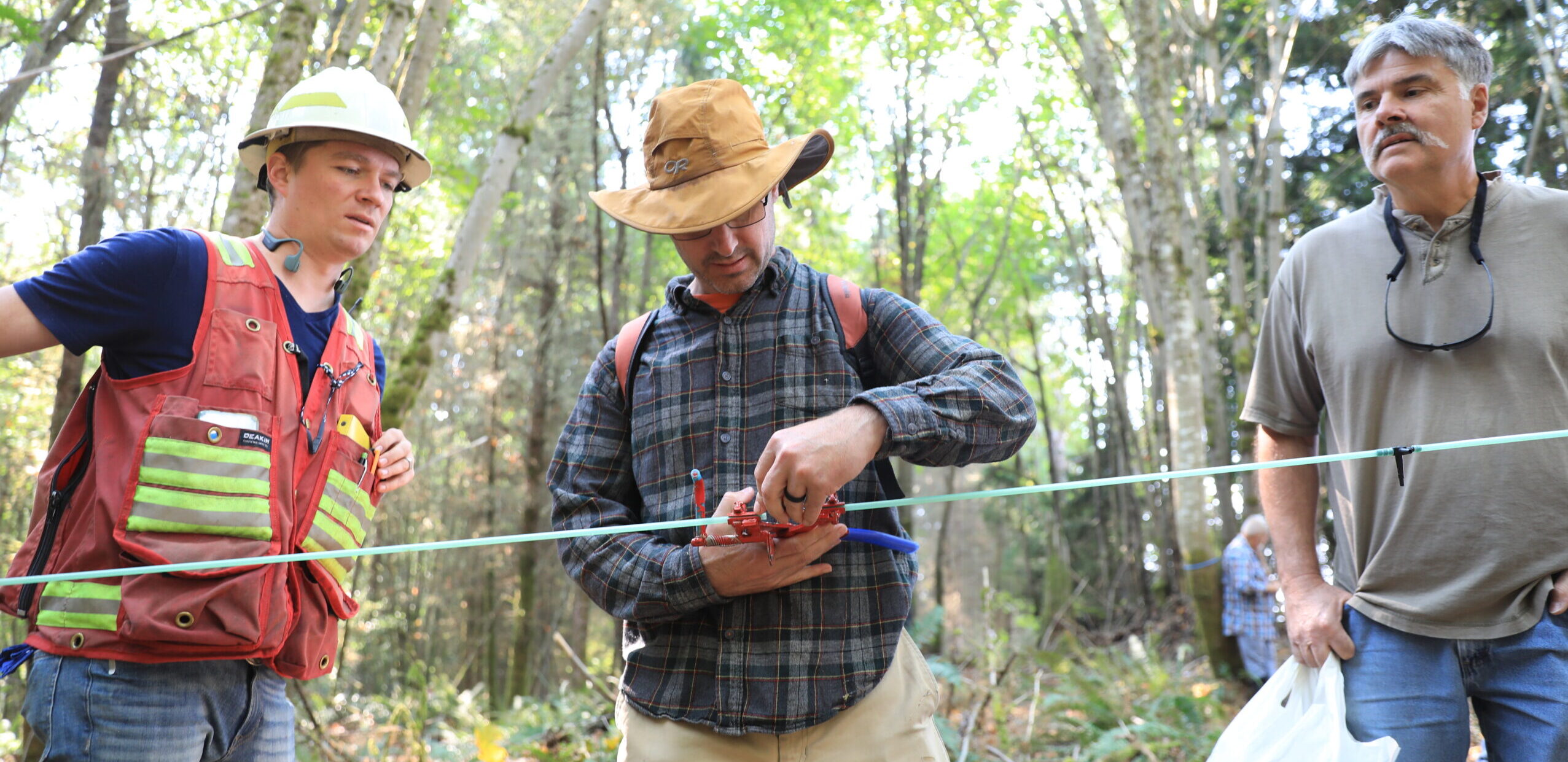 A workshop participant setting up a maple tubing system. 