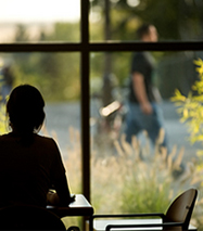 Girl looking out window.