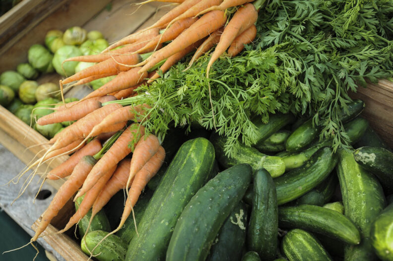 Boxes of fresh produce line the tables at the Salmon Creek Farmers Market at Legacy Salmon Creek Medical Center, Tuesday July 26, 2016. (Ariane Kunze/The Columbian)