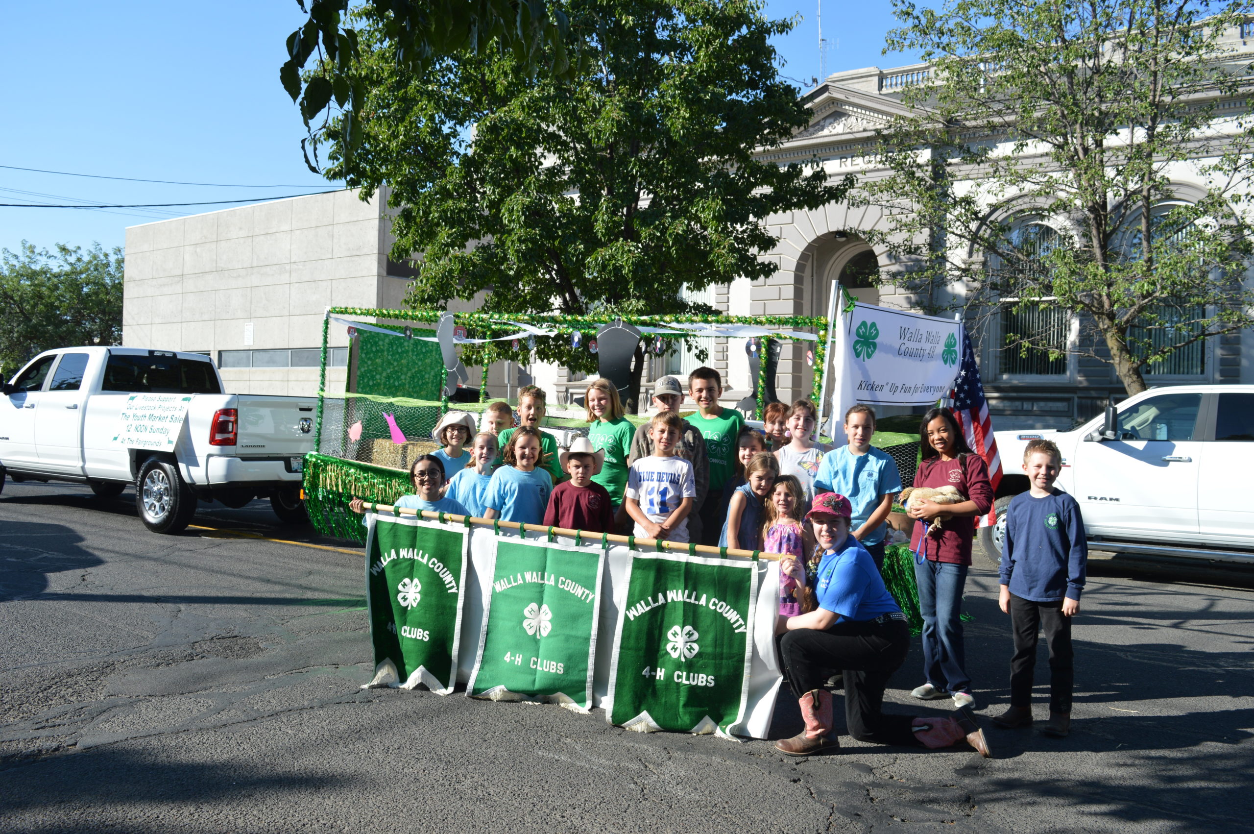 Group of youth holding 4-H banner