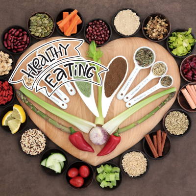 cutting board surrounded by healthy foods