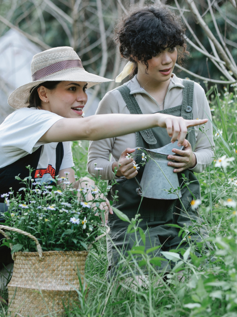 Two women in a flower garden