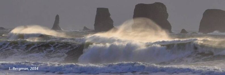 waves crash on large rocks in the Strait of Juan de Fuca.