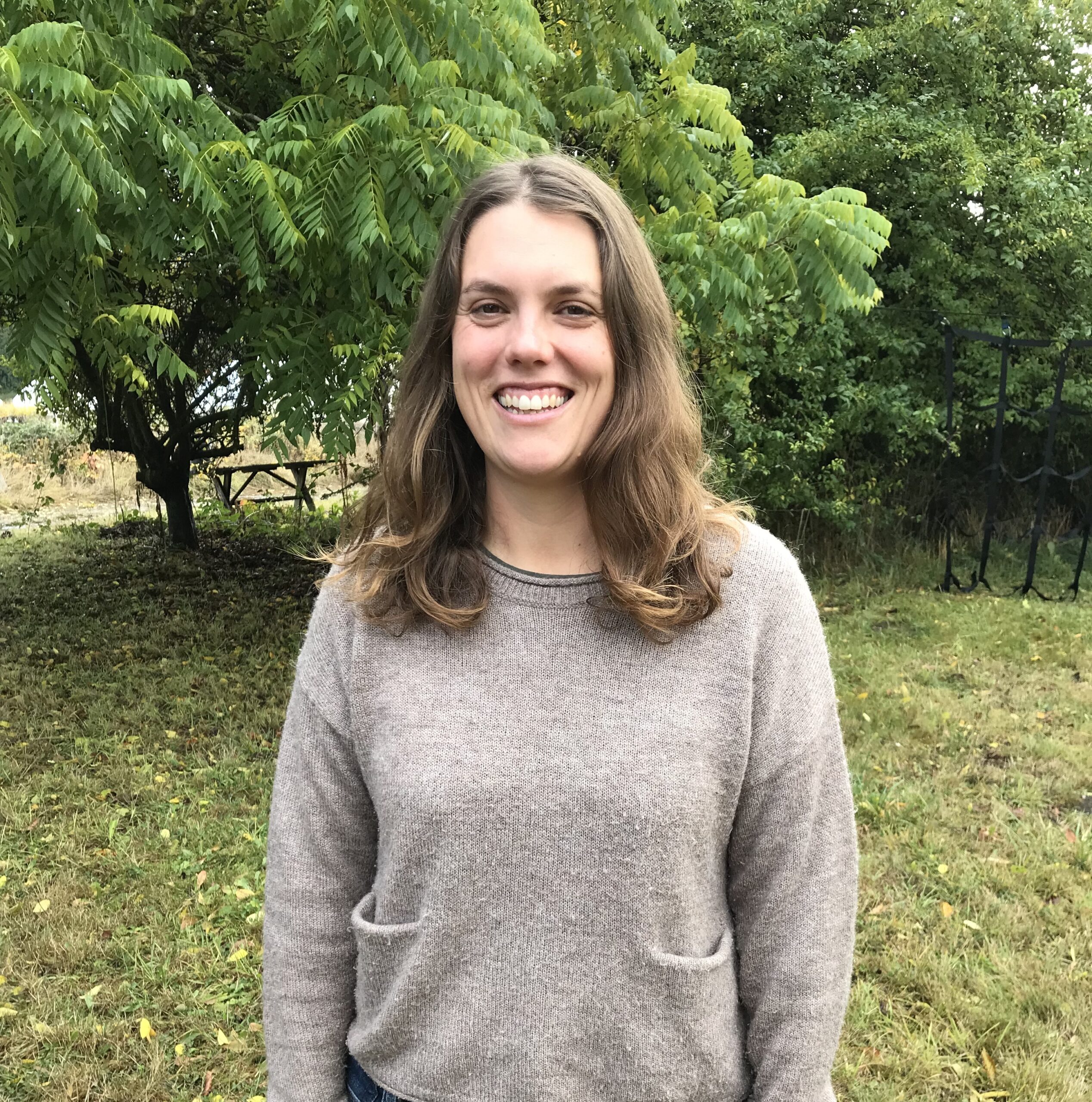 A portrait of Sallie Constant, Farm to Food Bank Program Coordinator.