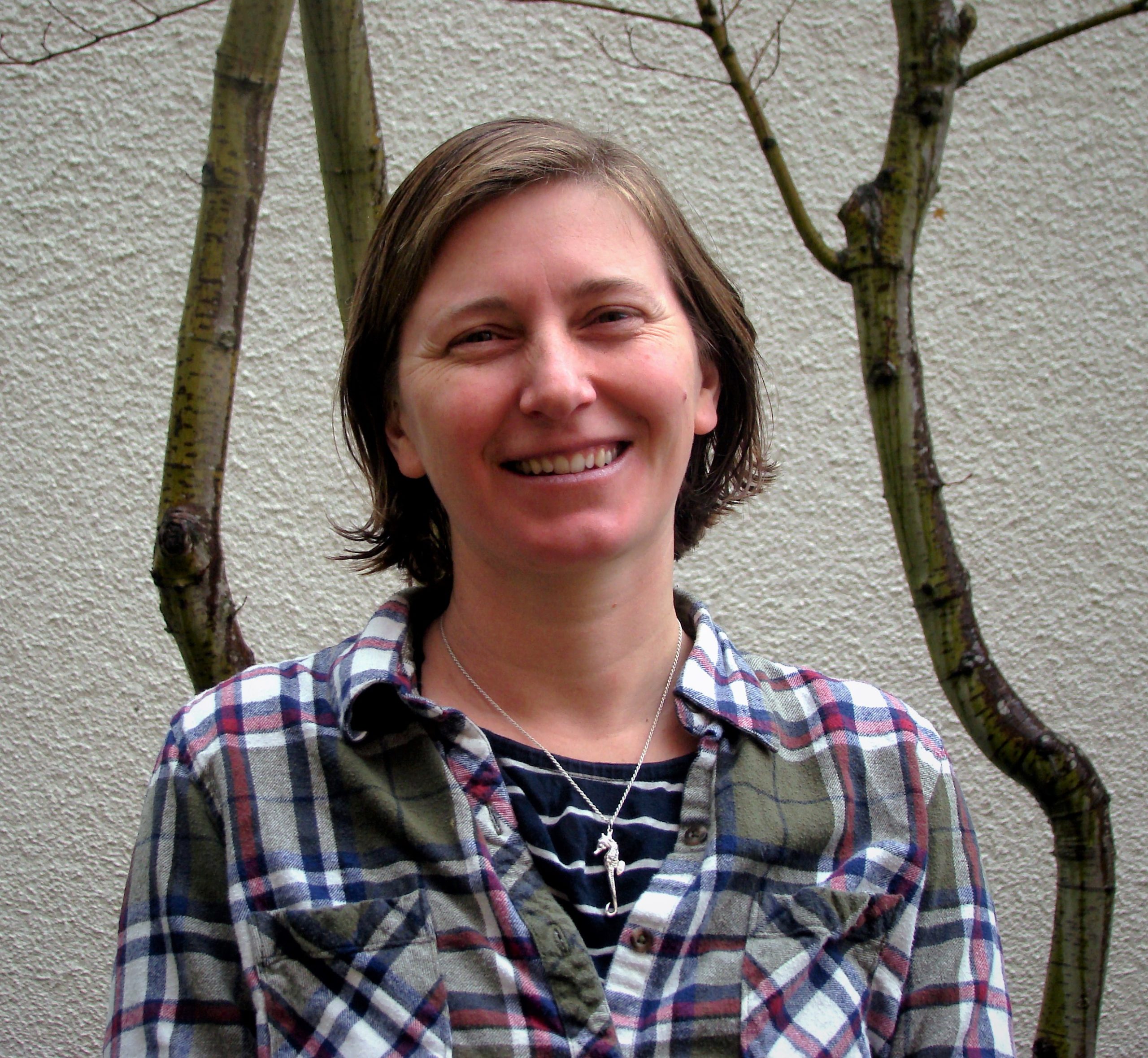 A portrait of Sharah Truett, Gleaning Program Coordinator.