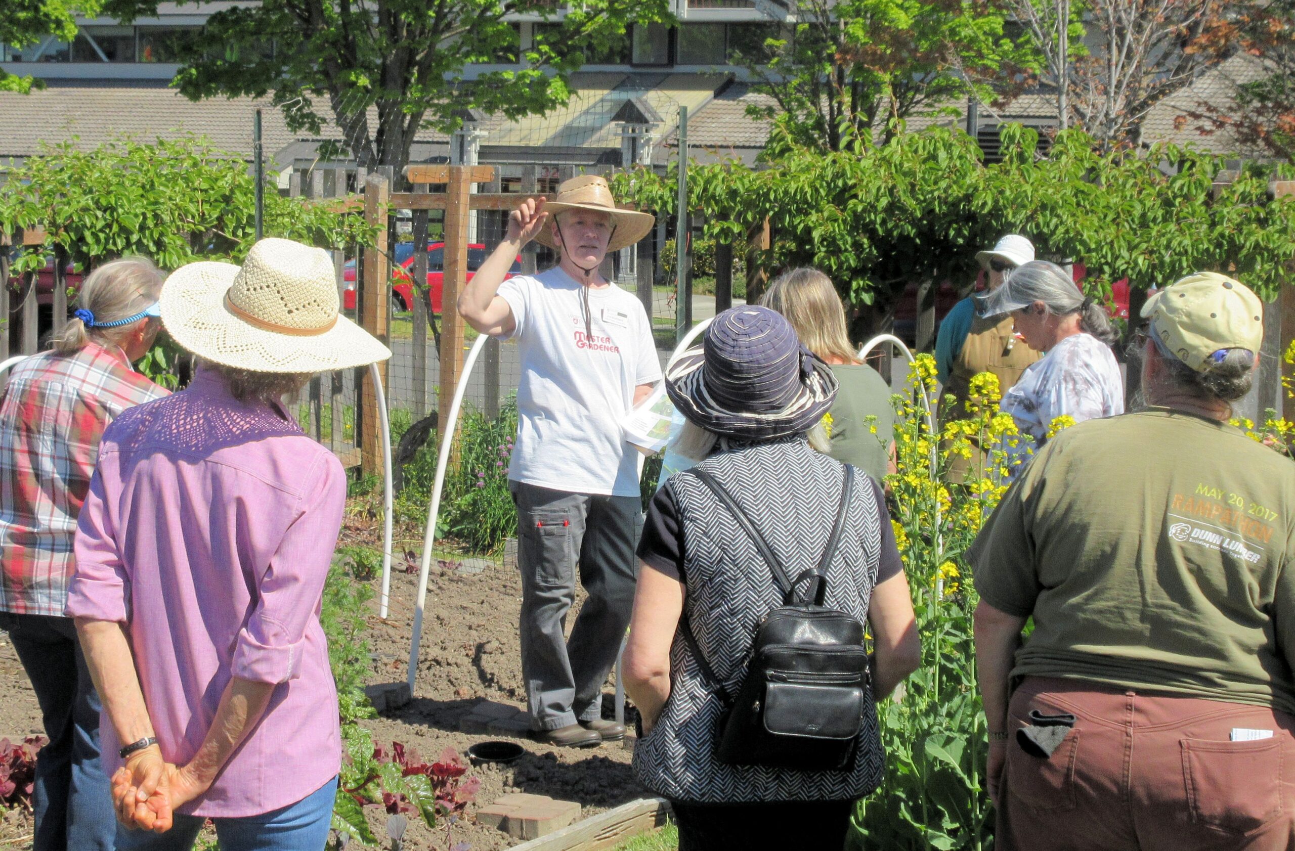 A Master Gardener gives a presentation at the 5th Street Community Garden.