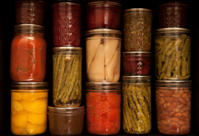 Rows of jars of home-canned fruits and vegetables