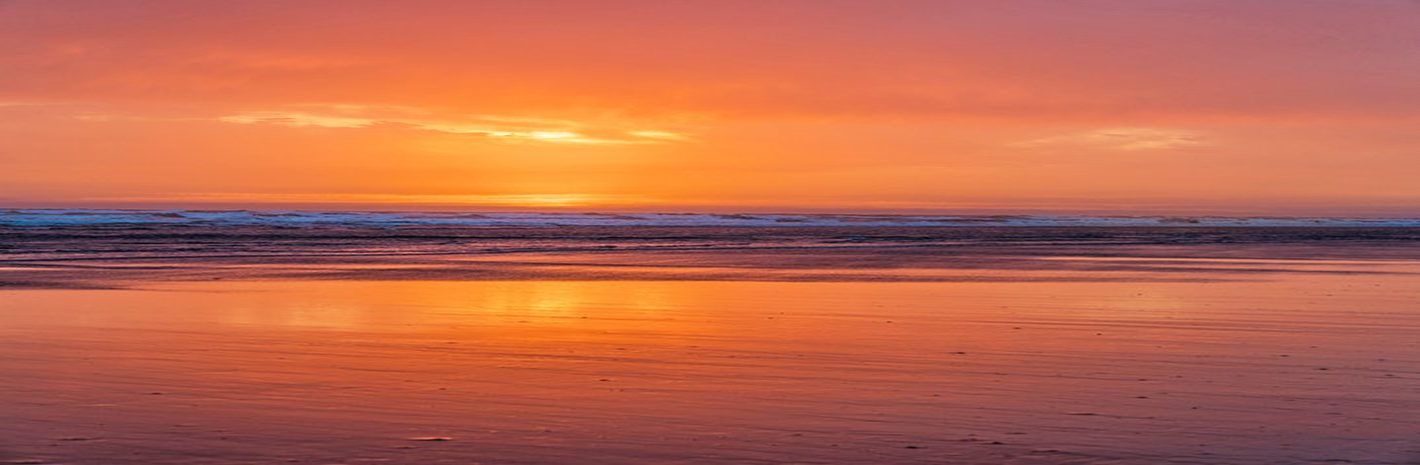 Sunset over the ocean shoreline