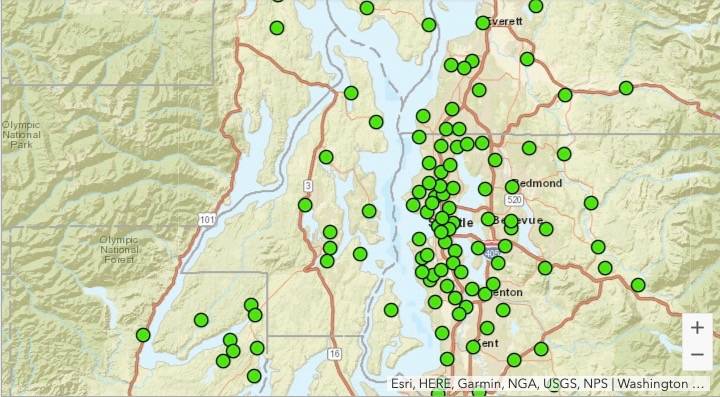 Map of western Washington state showing clusters of green dots, indicating data points or locations, concentrated around the Puget Sound region.