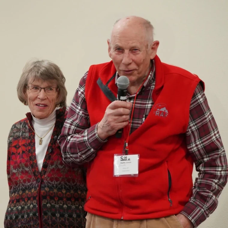 Chuck Jarecki speaking with a microphone.