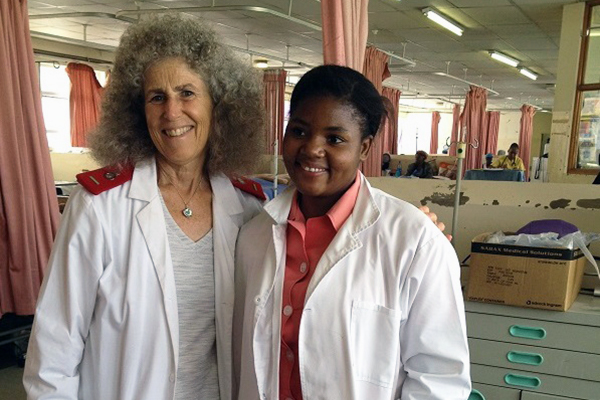 Dr. Louise Kaplan standing with nursing student in profile