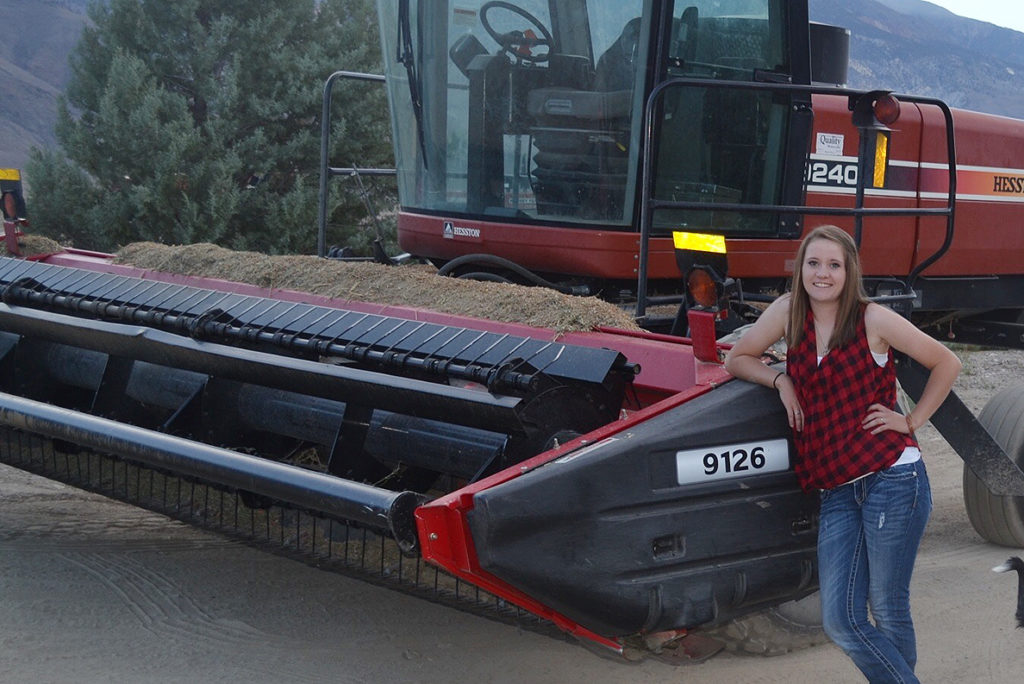 Katie Doonan with swather in field.