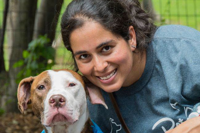 A closeup of Singh and her dog.