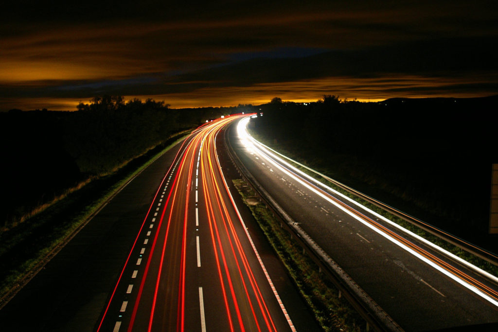 Streaks of freeway traffic lights at night.