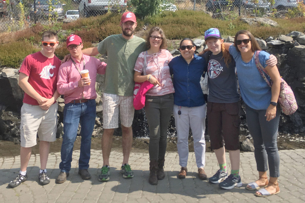 Barrio and ROAR students gather in front of a water feature in downtown Pullman.