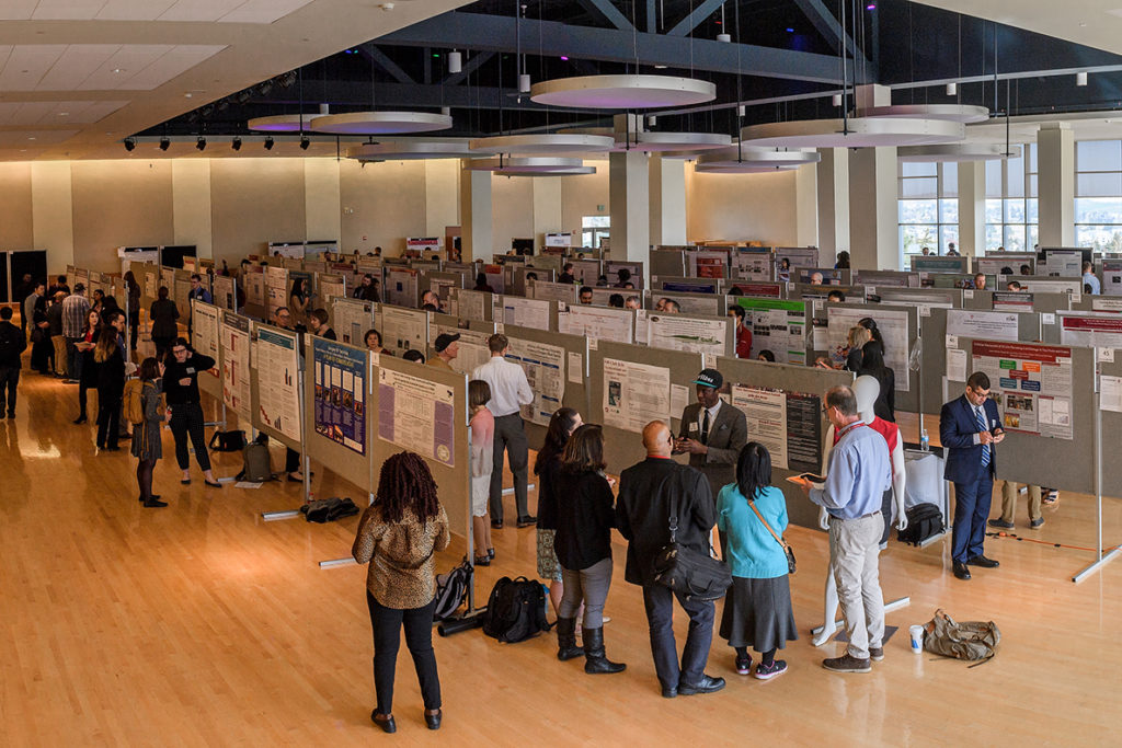 Showcase 2018 participants and poster board displays in the CUB Senior Ballroom.