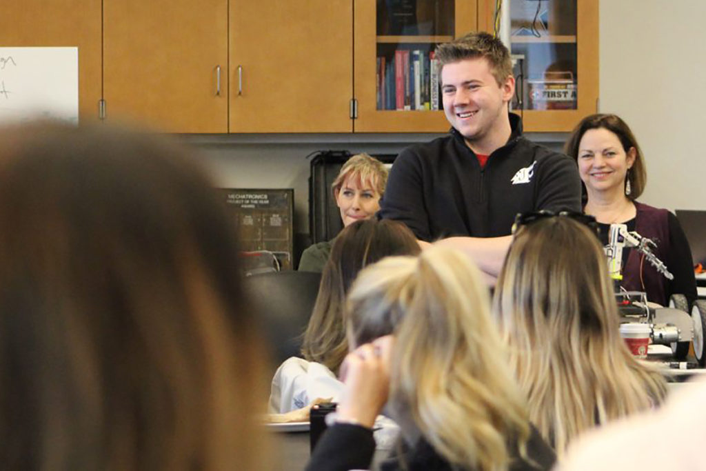 Students in classroom learning to work together on projects.
