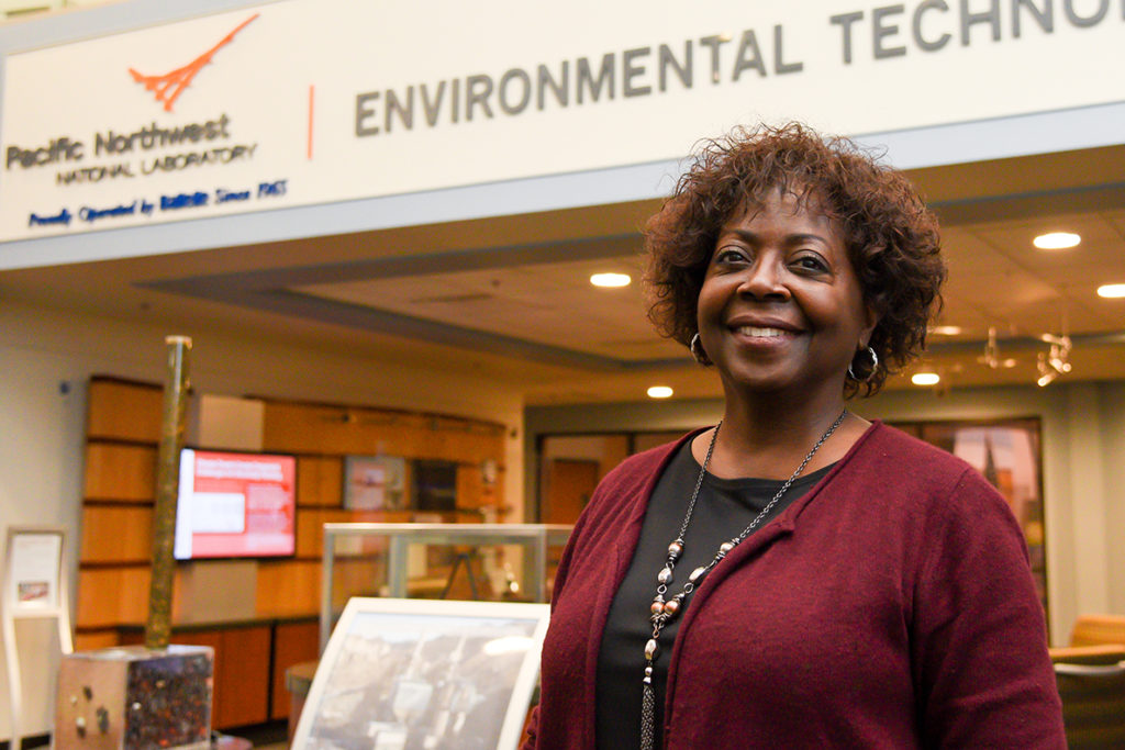 Closeup of Moore in front of a PNNL environmental technology business office.