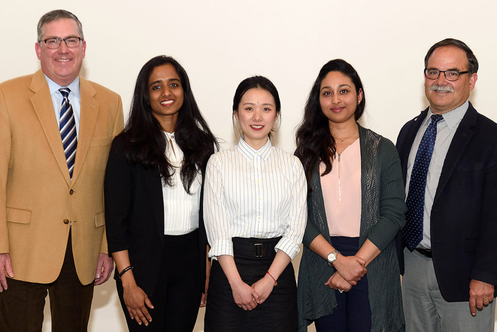Schulz and Bernardo stand with the winners of the 2019 Three-Minute Thesis competition at WSU.