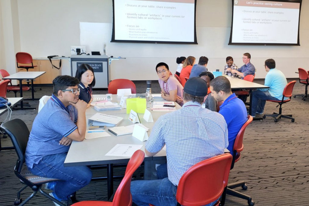 Students interacting in a classroom.